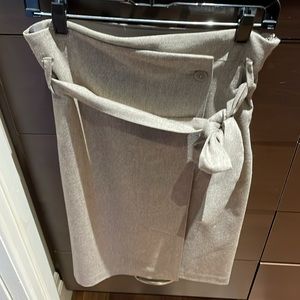 Babaton knee length beige wrap skirt.
